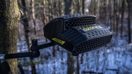 Ozonics HR600 scent-elimination unit mounted above a winter treeline